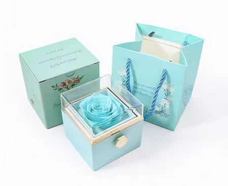 Romantische draaiende sieradendoos met eeuwige roos in blauw